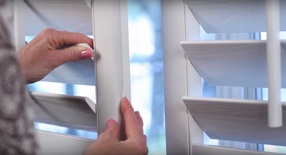 Interlocking the weatherstripping on white Polywood shutters